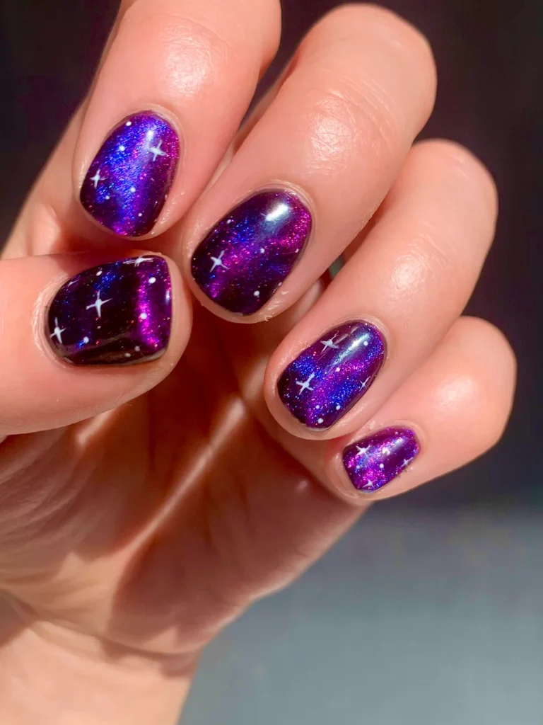 Black nails with glitter scattered like stars